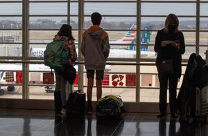 Holiday weekend flight cancellations highlight debate over new COVID rules